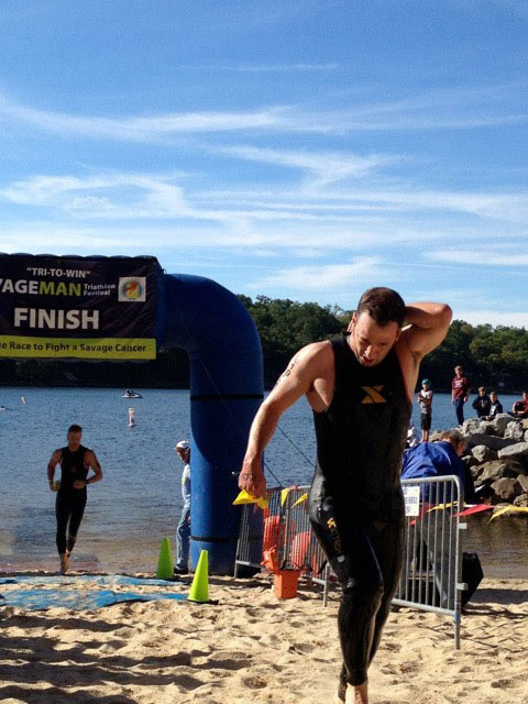 Timothy Bachman exiting lake after a swim event
