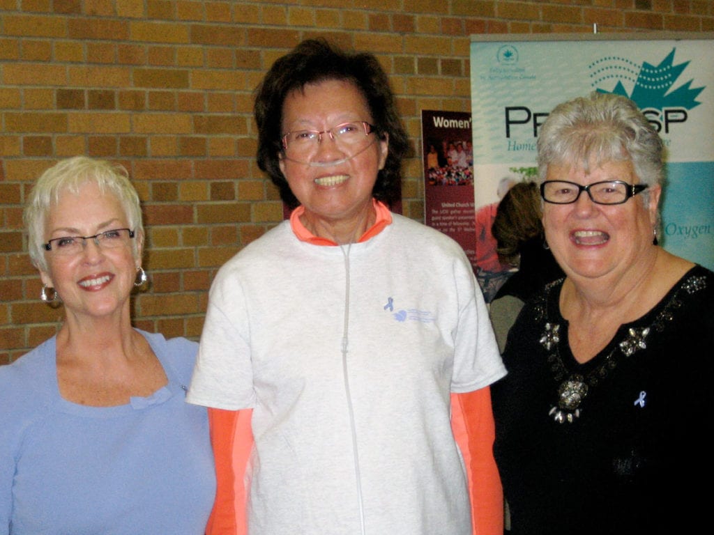 Jeannie Tom and two friends at a conference