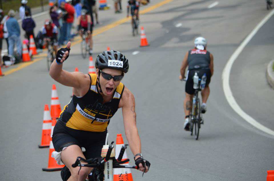 vicki dolan giving the thumbs up while cycling