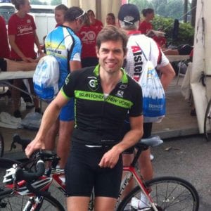 Axel Schauf smiling with bike