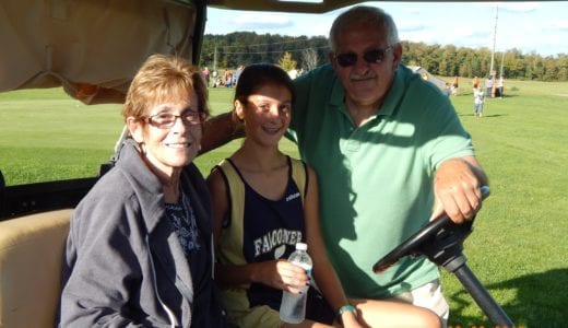 Cynthia pictured with her husband, Denny at her granddaughter's cross country meet. The home meets are held at a golf course and her son-in-law arranged for her to use a golf cart so she could follow the race. ( She always takes her oxygen off for photos.)