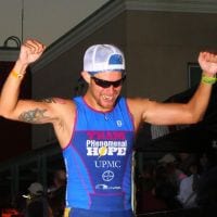 Jaime Martinez crossing the finish line at Vineman Ironman